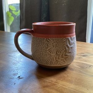 Potter’s corner terracotta color mug with floral etching